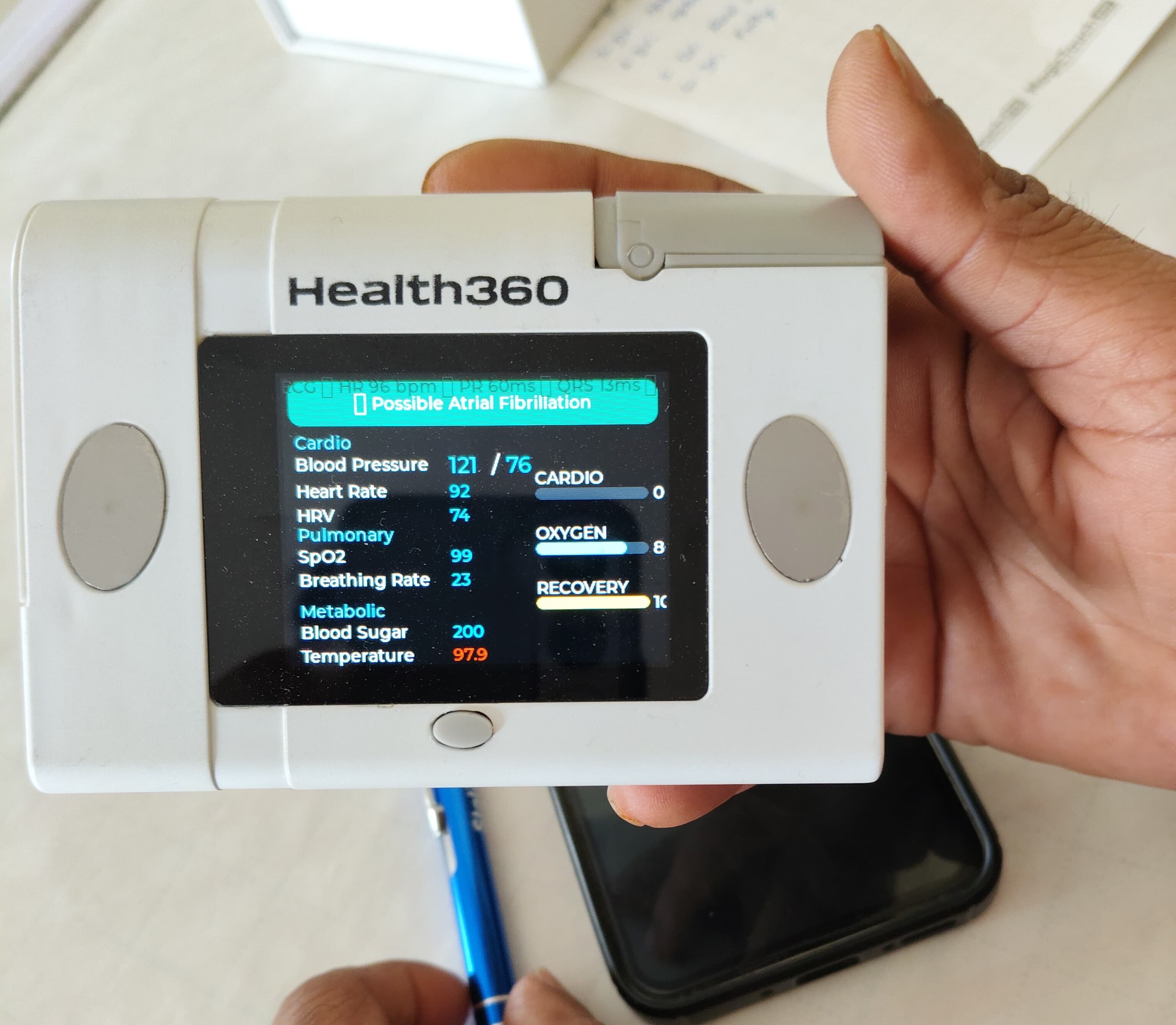 The Health360 diagnostic device showing cardio, pulmonary, and metabolic readings