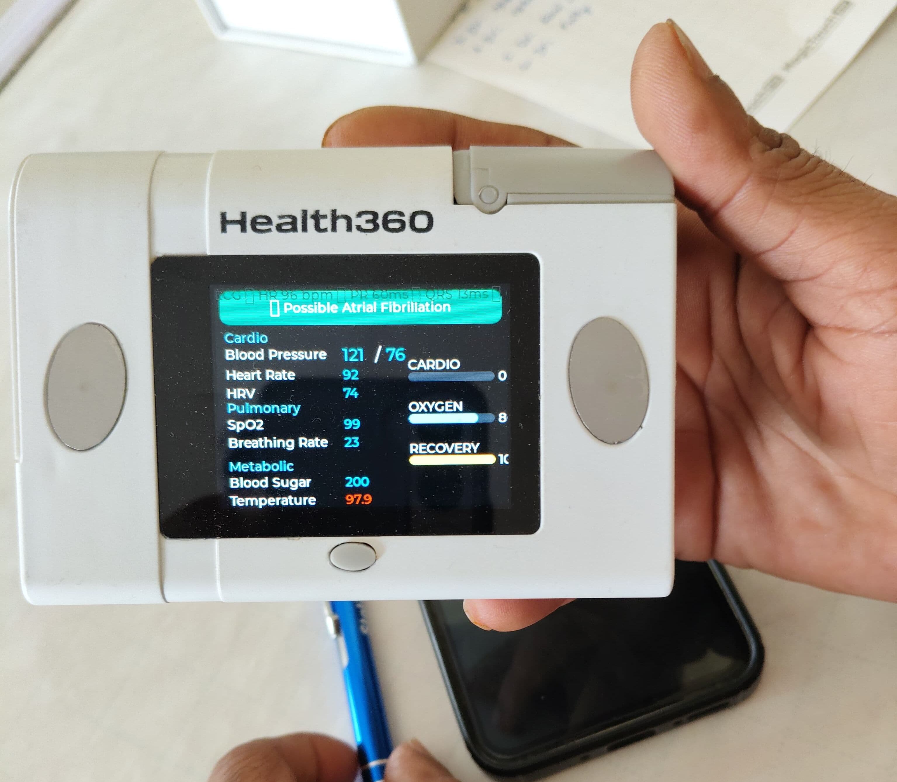 The Health360 diagnostic device showing cardio, pulmonary, and metabolic readings
